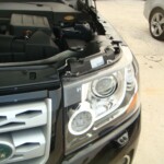 Before and after photographs of a damaged, black, Range Rover that was repaired by Elite Paint & Body Shop in West Palm Beach, FL.